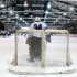 The Violets skate to congratulate goaltender Sam Daley after winning against UConn.