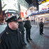 Police officers stand in Times Square following the Eric Garner decision.