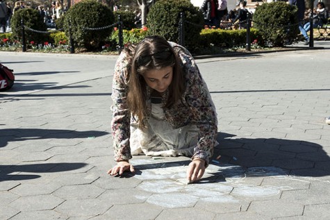  Organizers of the event chalk to attract the attention of people in Washington Square Park.