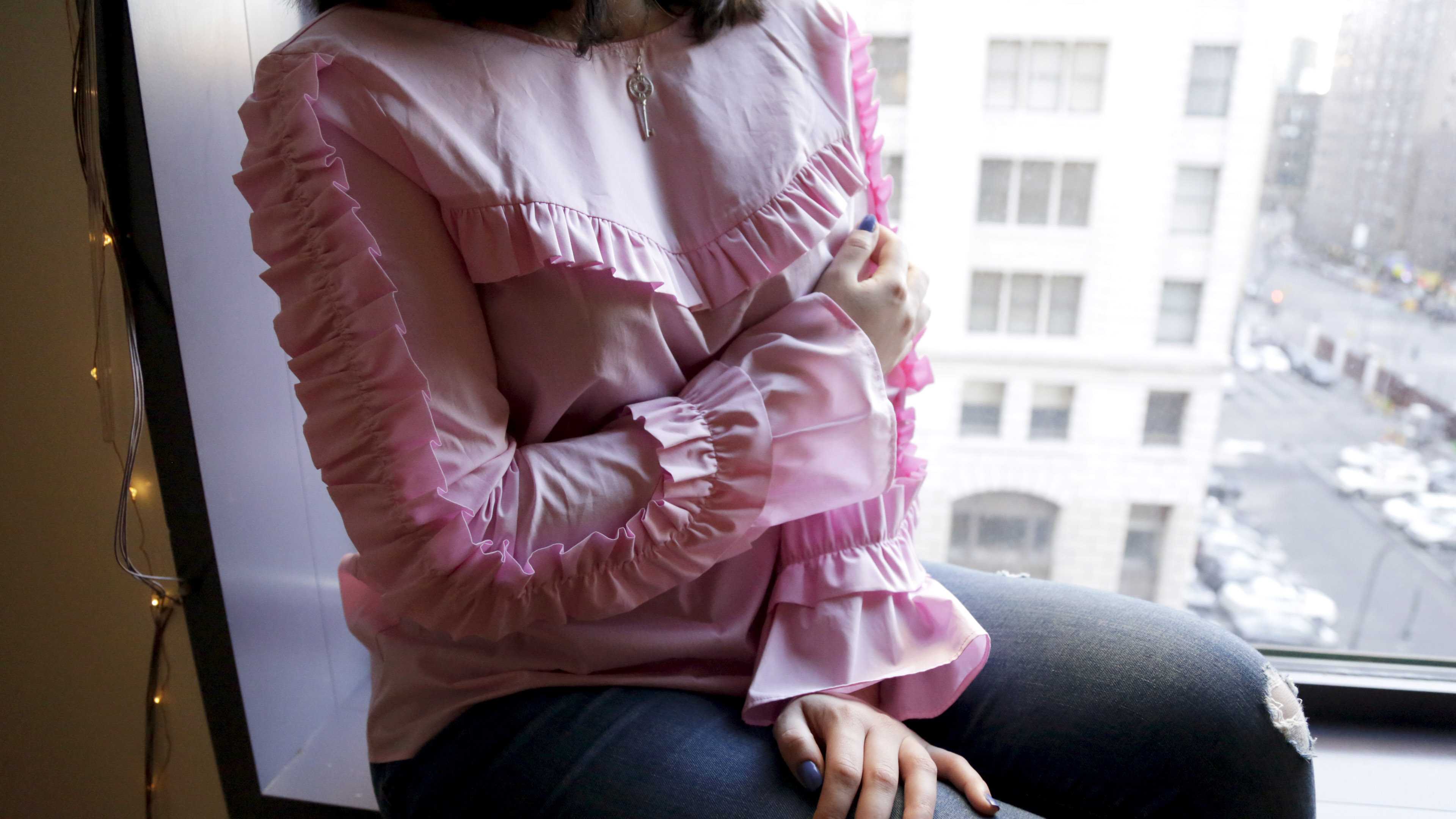 This pink ruffled shirt fits in with the spring/summer 2017 runway trends. In fact, Michael Kors incorporated subtle ruffles in over 50 looks in his spring/summer collection.