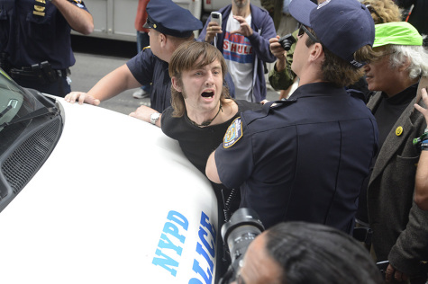 Flood Wall Street sets sights on capitalism, arrests made