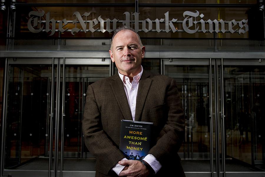 Columnist+Jim+Dwyer+stands+in+front+of+the+New+York+Times+building+with+his+new+book%2C+%22More+Awesome+than+Money%2C%22+about+four+NYU+undergraduates+who+attempted+to+create+a+new+social+network.