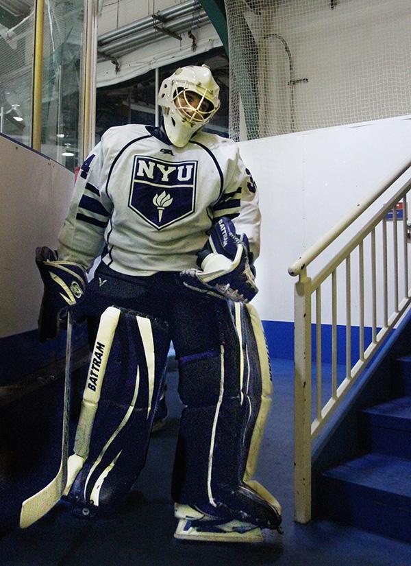 Goaltender Sam Daley walks to the locker room between periods.