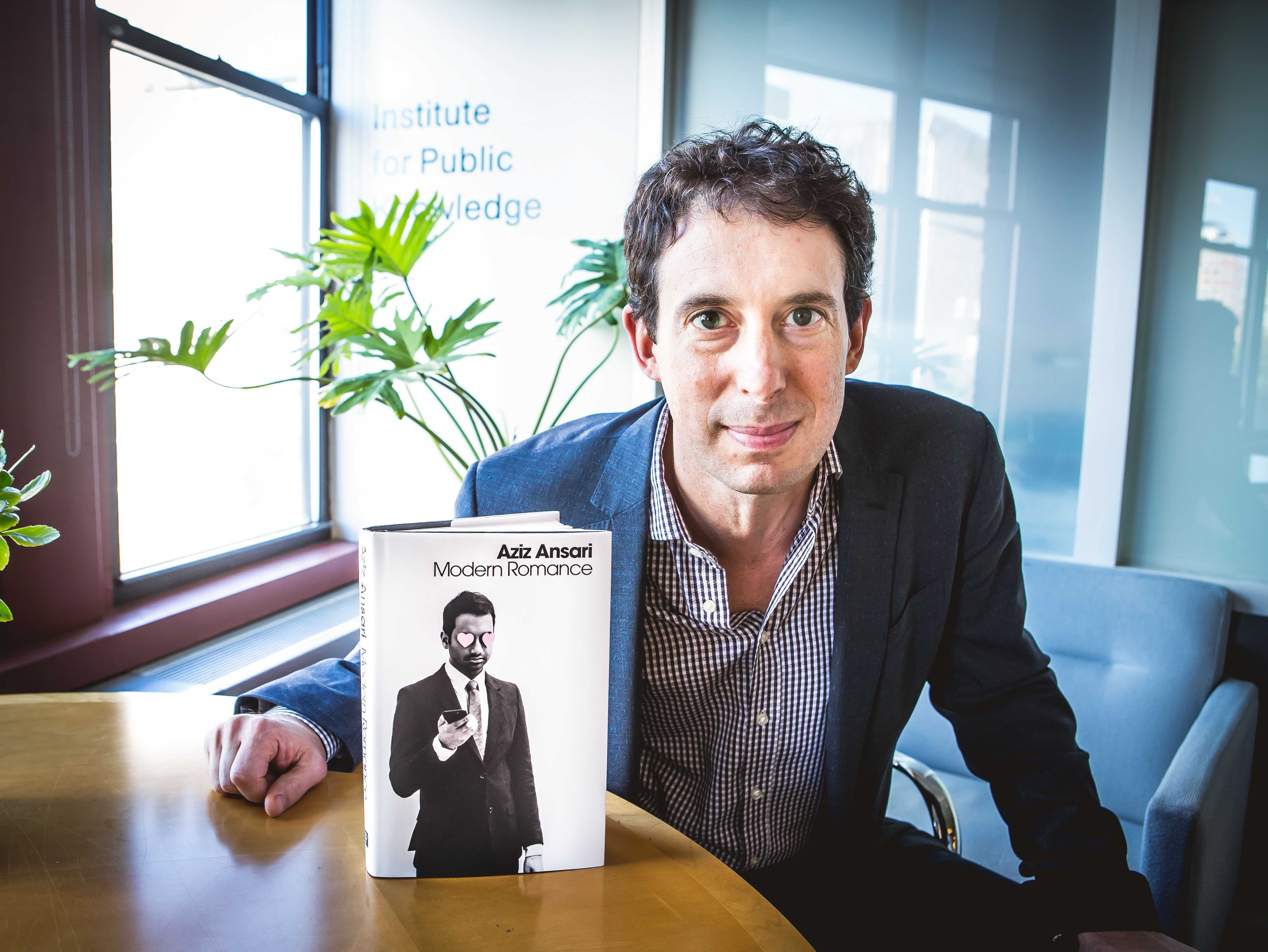 Eric Klinenberg, Professor of Sociology at NYU, is pictured with his recently published book, “Modern Romance