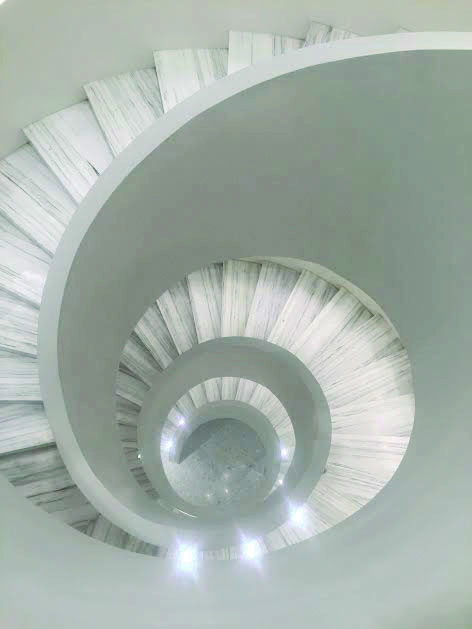 As+the+centerpoint+of+the+new+Barneys+flagship%2C+the+spiral+staircase+leads+customers+through+retail+heaven.