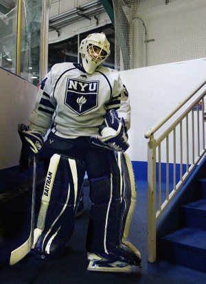 Goalie Sam Daley walks to the locker room between periods.