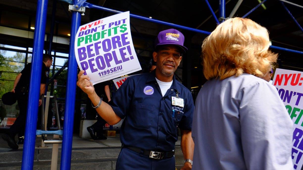 Hundreds of union members march outside NYU Langone to protest the recent proposal to cut worker benefits.
