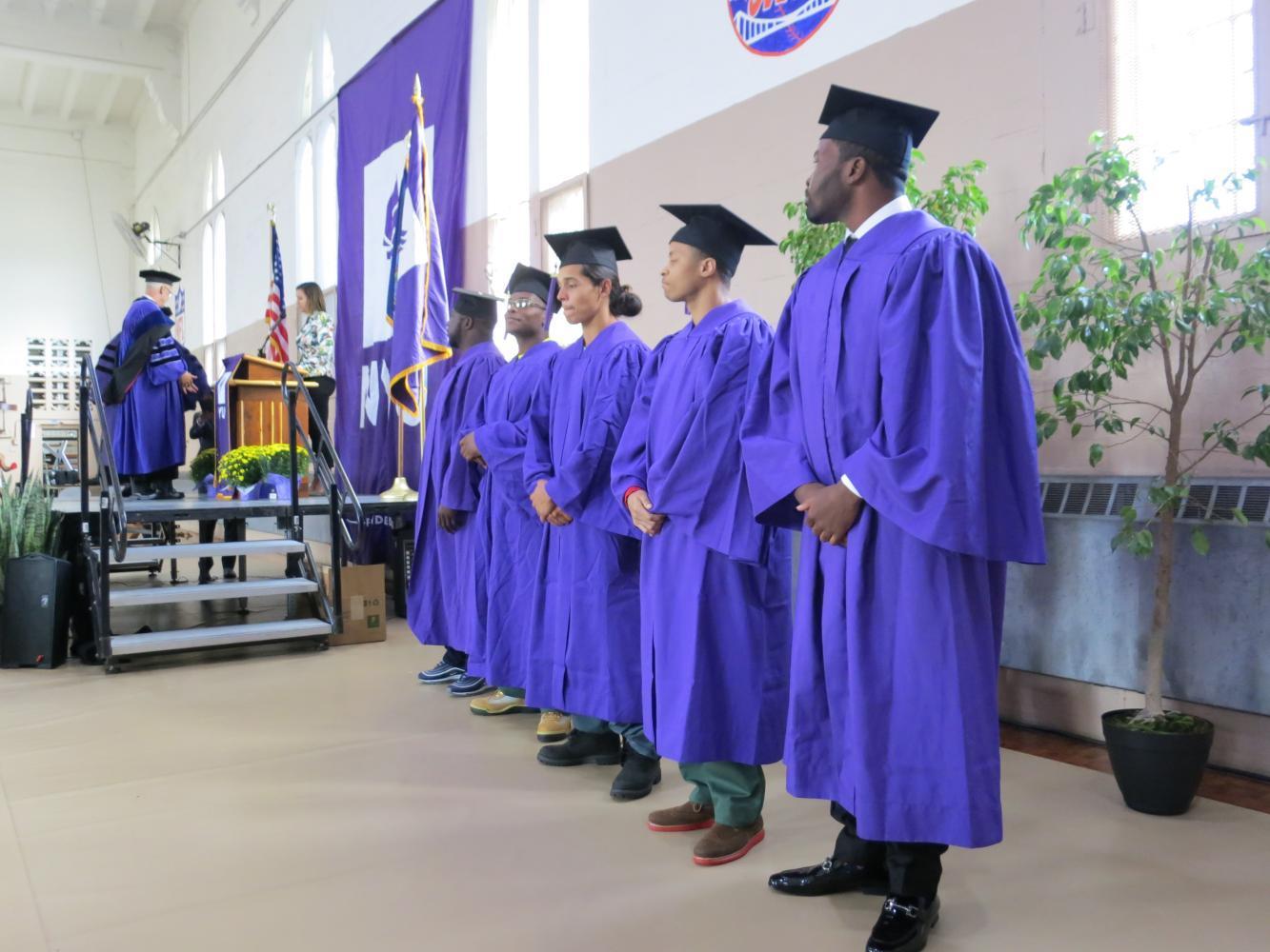 President Hamilton and Gallatin Dean Susanne Wofford attended the first graduation of NYU's Prison Education Program where five students received associate's degrees in Liberal Studies.