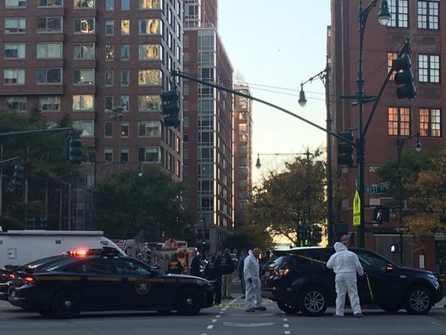 A+recent+attack+on+civilians+in+lower+manhattan+has+left+at+least+eight+dead+and+11+injured.+Forensics+and+police+gather+to+investigate+and+control+the+scene.+%0A
