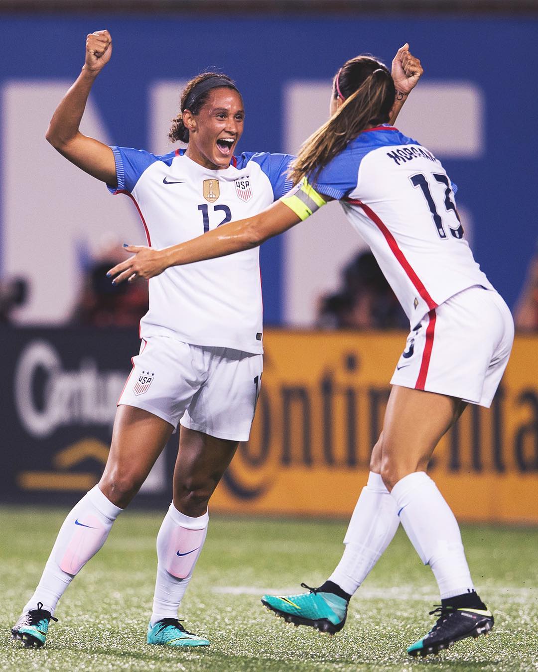 US women's soccer team players Lynn Williams and Alex Morgan celebrate after a game in North Carolina.