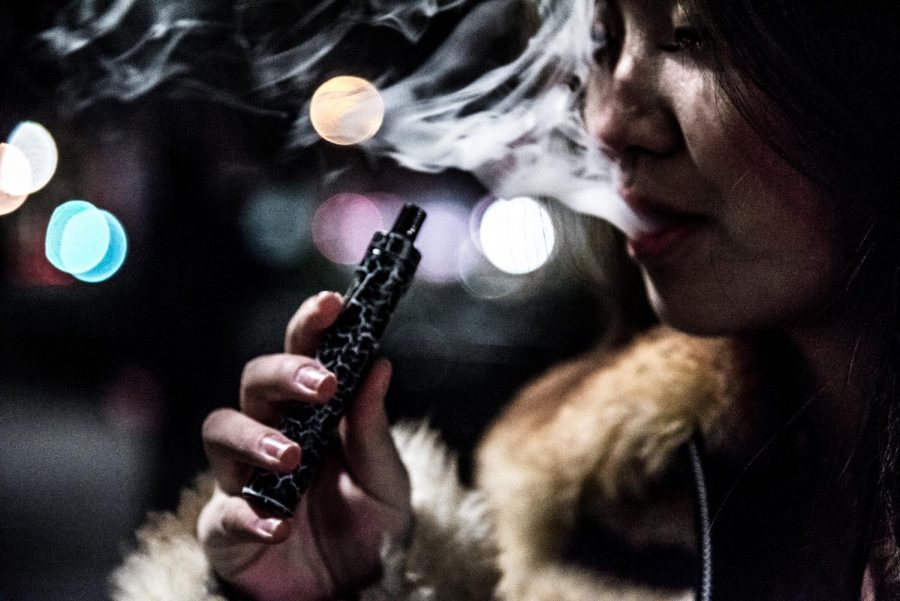 A+first-year+vapes+in+Union+Square+at+night.+She+only+started+vaping+since+being+at+NYU%2C+primarily+doing+so+on+nights+out.