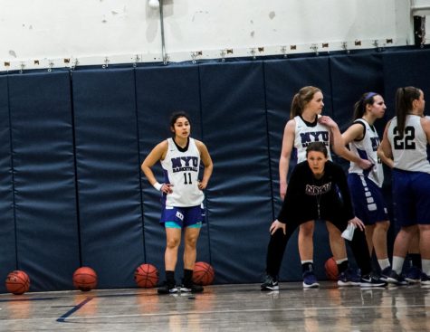Women’s Basketball Coach Earns 100th Win