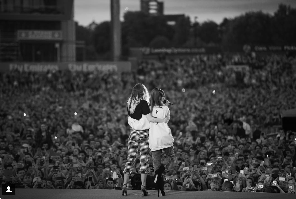 Ariana Grande sings along with Miley Cyrus during the One Love Manchester Benefit Concert after the terrorist explosions from her previous concert at Manchester that left several dead.