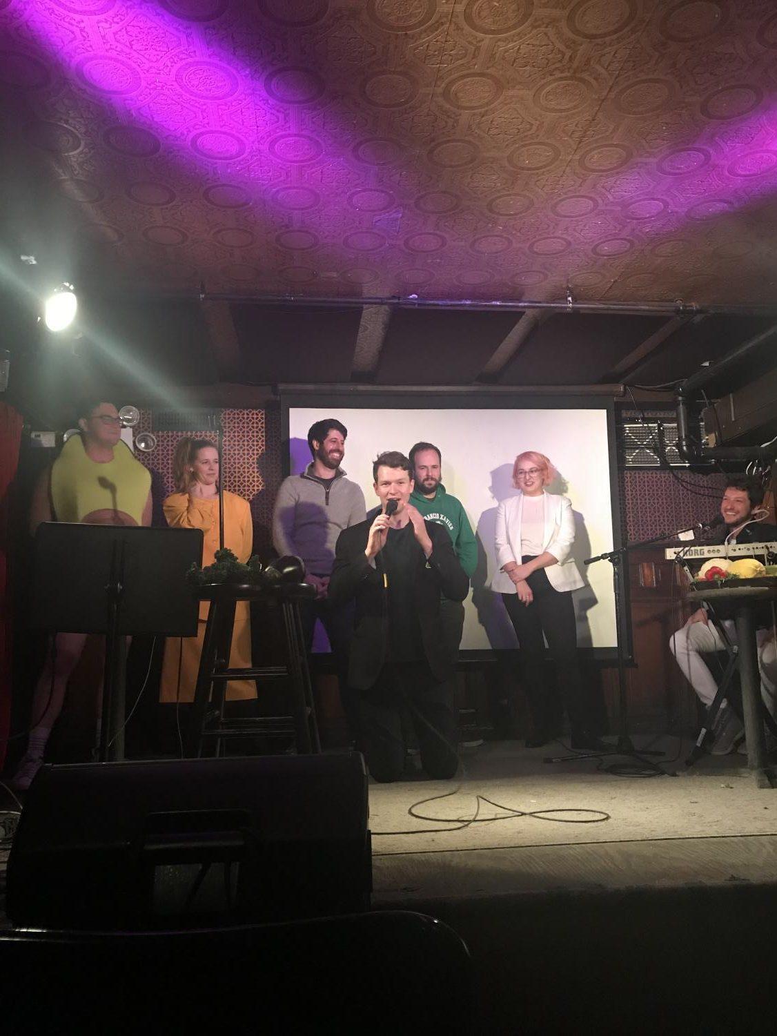 An ensemble of comedians performed in
