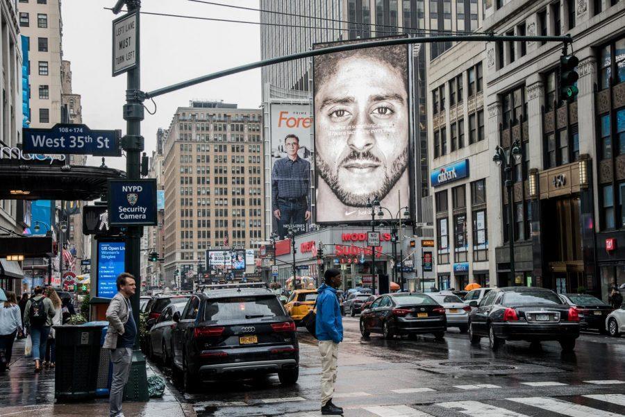 Nike+recently+unveiled+a+new+series+of+advertisements%2C+including+this+billboard+of+Colin+Kaepernick+by+Madison+Square+Garden.+The+text+over+the+image+of+Kaepernick%2C+the+NFL+quarterback+who+started+protesting+police+brutality+in+2016%2C+reads+%22Believe+in+something.+Even+if+it+means+sacrificing+everything.%22